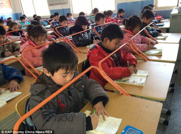 roller bars maintain distance between student and his work, protecting his eyesight