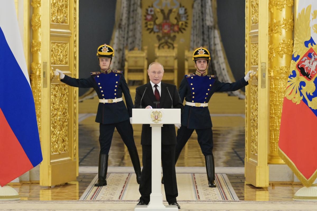 Putin and guards in the Kremlin